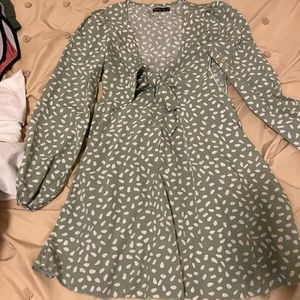 Green polkadot dress with bow in front